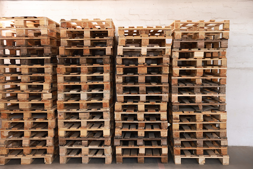 Wooden pallets. Old wooden box. Recycling plant.