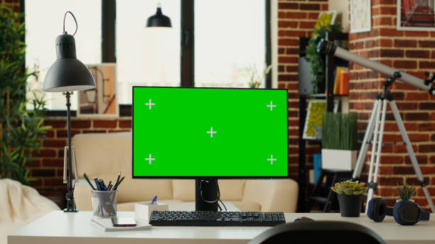 istock Empty office with monitor and greenscreen on computer 1436124648