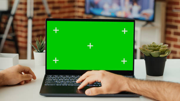 istock Male freelancer working on laptop with green screen template 1436125525