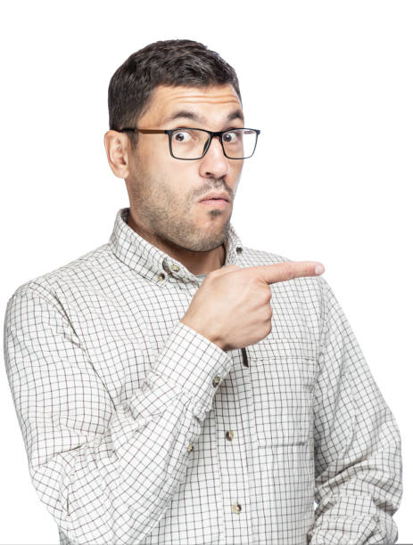 istock Handsome man with glasses and a plaid shirt, pointing at something from the side 1436126014