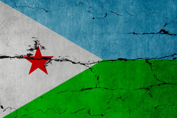 Flag of Djibouti painted on worn out wooden texture background.
