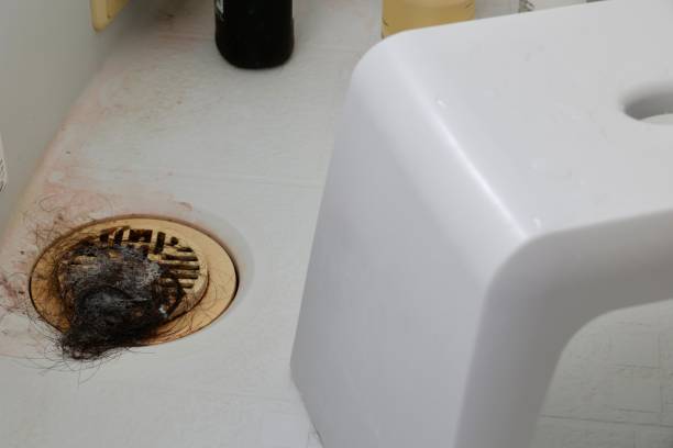 istock Hair piled on top of bath drain. 1436126941