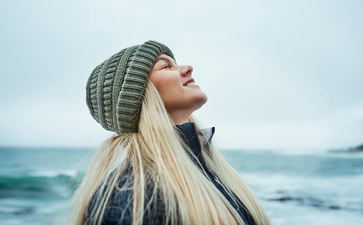 Portrait of a beautiful young woman enjoying a wintery day outdoors