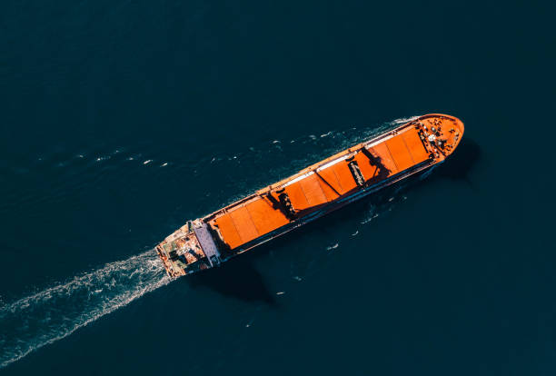 istock Bird Eye View Cargo Ship in Cruising at Sea 1436128099