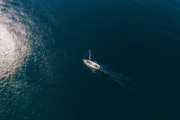 istock Drone View Sail Boat in Cruising at Sea 1436128192