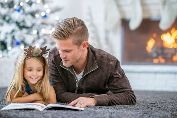 istock Reading with Dad on Christmas Morning 1436130959
