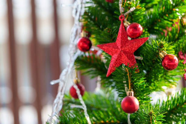 istock Christmas tree background and Decorated Christmas tree on blurred background. 1436131793