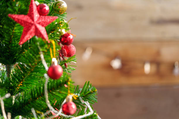 istock christmas lights background with decorations on wooden background. 1436132107