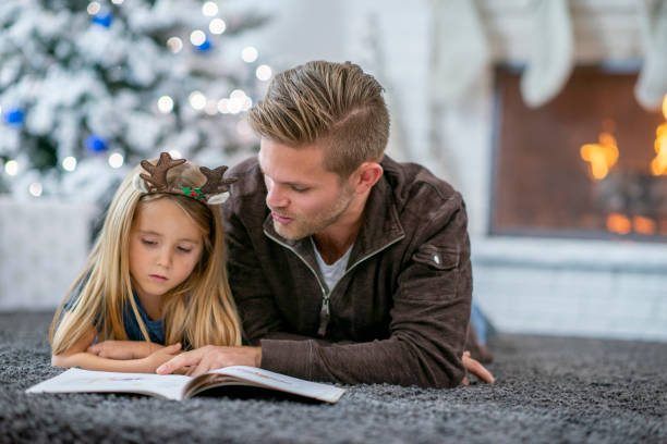 istock Reading with Dad on Christmas Morning 1436133686