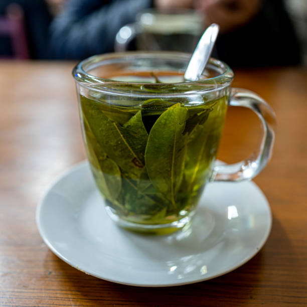 istock coca tea in a glass cup on a wooden table 1436137316