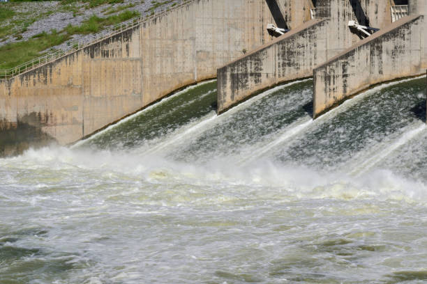 istock Shallow rapid water streaming from dam water spillway to water surface. 1436138889