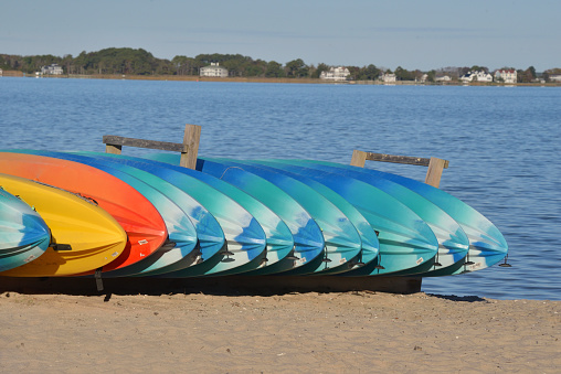 Paddleboards stacked up on the Assateague Island National Seashore beach waiting for a warm winter or early spring