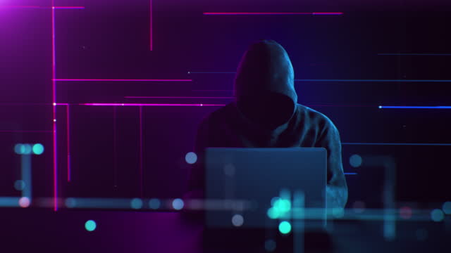 Unrecognizable Hacker in Hoodie Working on Laptop in Digital Environment. Abstract Anonymous Man Typing, Hacking into Security Systems. Cybercrime and Internet Protection Technology Concept