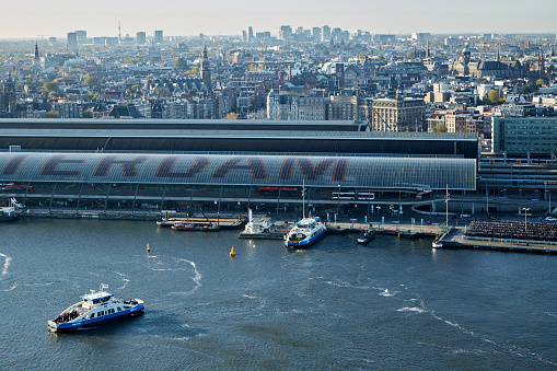 Aerial view cityscape of Amsterdam Centraal Railway Station and ferry boats, Amsterdam, The Netherlands