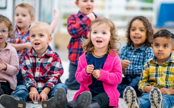 Preschool Children Singing During Circle Time stock photo