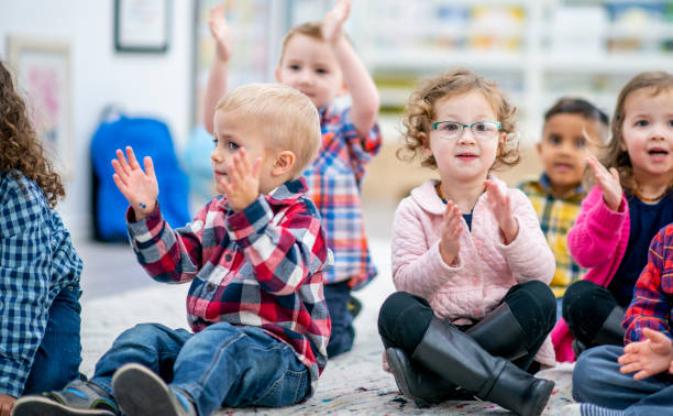 istock Preschool Children Singing During Circle Time 1436145335
