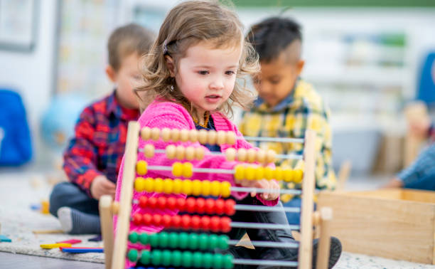 istock Preschool Child Playing with an Abacus 1436145343