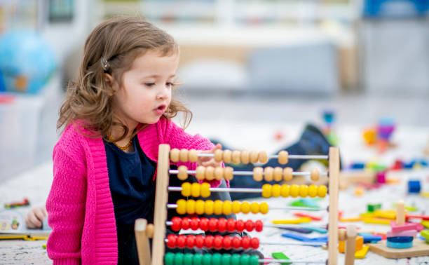 istock Preschool Child Playing with an Abacus 1436145354
