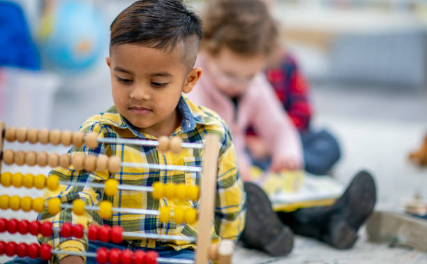 istock Preschool Child Playing with an Abacus 1436145366