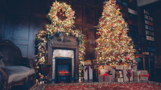 istock Cozy spacious room with decorated New Year tree and gift boxes and burning fireplace 1436145550