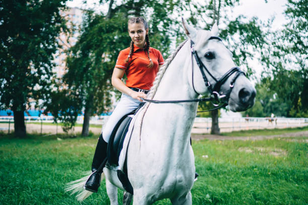 istock Female rider sitting astride horse 1436145568