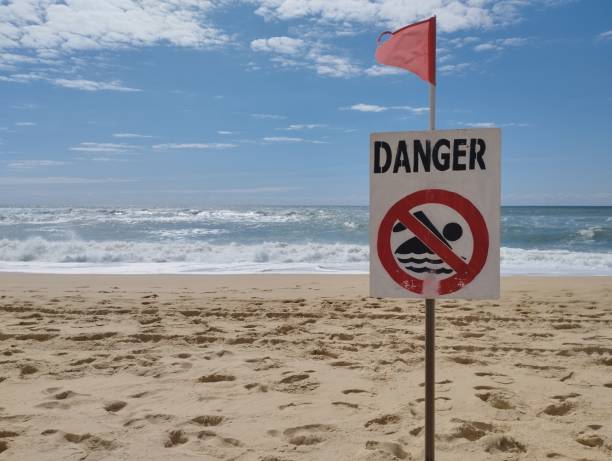 istock No swimming sign on the beach 1436147408