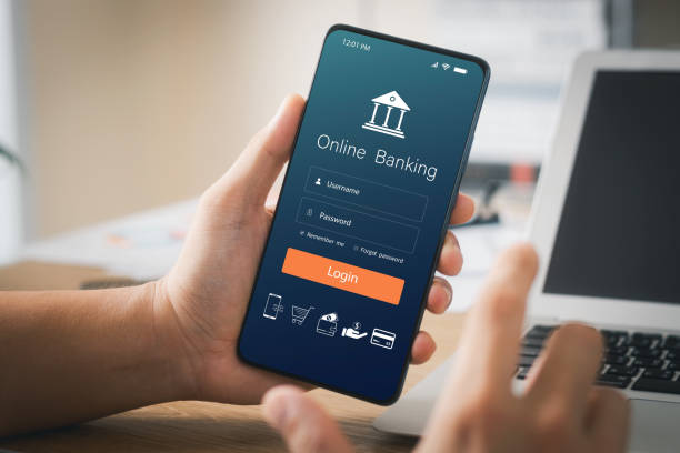 istock Male executive using smartphone to conduct online mobile banking, investing in stocks and mutual funds, retirement investment ideas. 1436149607