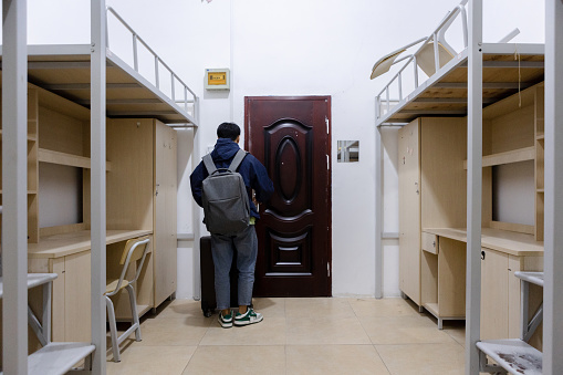 Graduating college students leave their dormitories