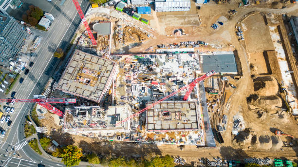istock Large construction site, cranes and equipment - aerial view 1436150814