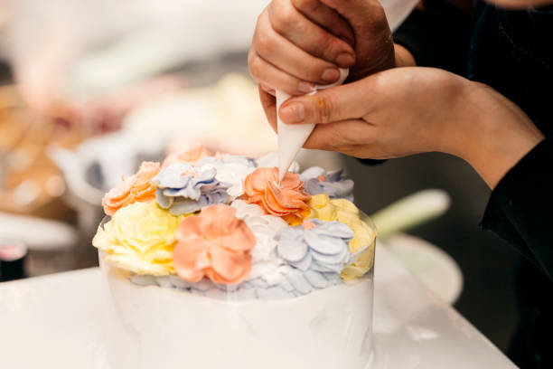 istock Making A Creamy Floral Cake Topper 1436153682