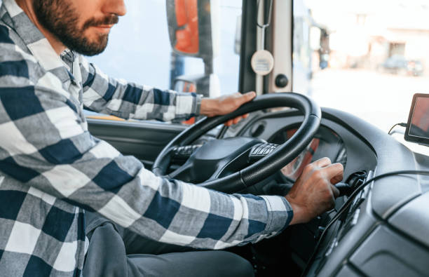 istock Turning engine on. Young truck driver is with his vehicle at daytime 1436157758