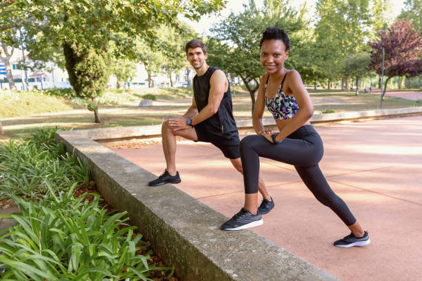 istock Couple stretching in park 1436158217