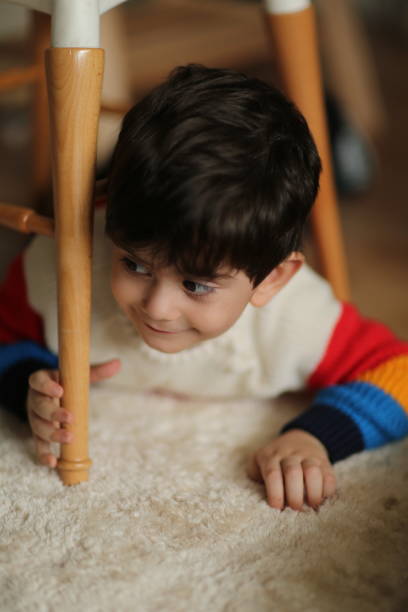 istock Young boy looking at globe in bedroom 1436160008
