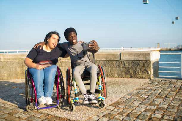 istock Cheerful biracial couple taking selfie on embankment 1436160318