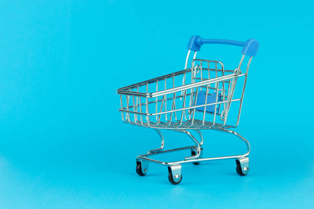 istock supermarket trolley on blue background 1436162243