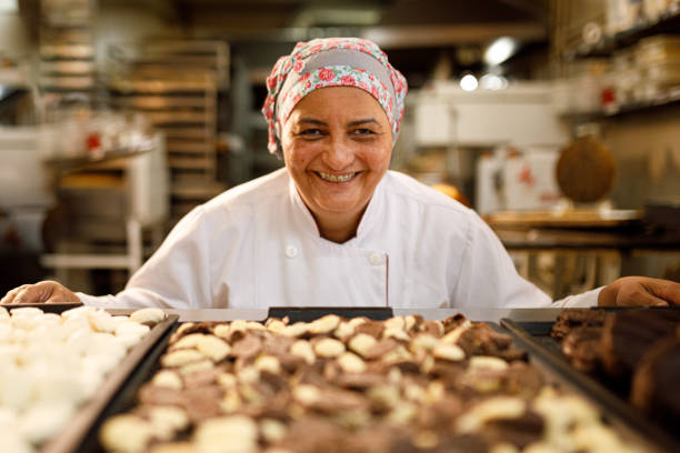 istock Woman admiring a nice batch of cookies 1436167519