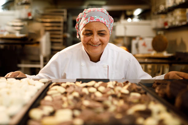 istock Woman admiring a nice batch of cookies 1436167520