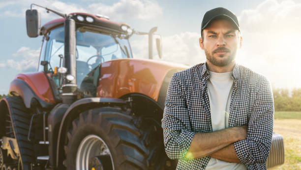istock Farmer with agricultural tractor 1436169155