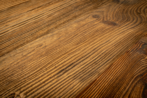 Old Wooden Texture Background Closeup. Dark Brown Wood Grain Diagonal Pattern, Vintage Pine Table Top, Dark Rustic Table Desk