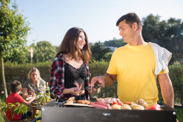 istock Caring father grilling meat and vegetables with daughter 1436171533