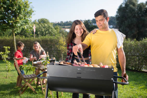 istock Content father grilling meat and vegetables with daughter 1436171564
