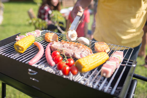 istock Tasty steak, sausages and fresh vegetables on BBQ 1436171646