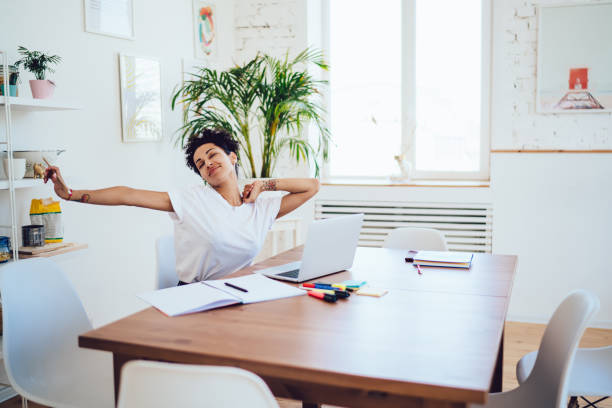 istock Peaceful calm woman recreating at desk and browsing laptop 1436171801