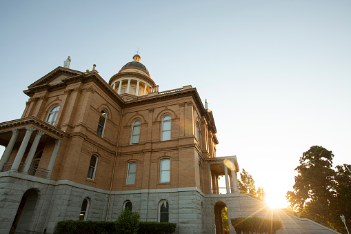 Sunlight shines on the historic 1898 Courthouse in downtown Auburn, California, USA.