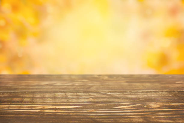 istock Autumn background with wooden table 1436174260