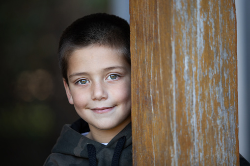 Argentinean 6 years-old boy portrait playing outside