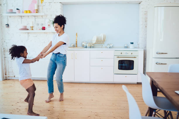 istock Kid enjoying playing with mother 1436182434