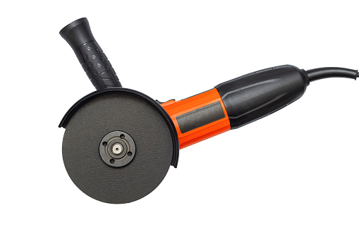 Angle grinder with abrasive disk isolated on a white background.