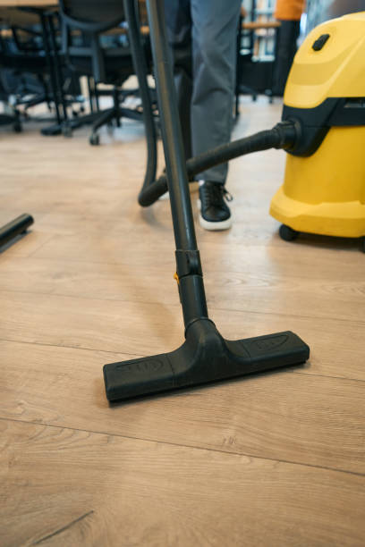 istock Cleaning a coworking space with a vacuum cleaner 1436184078