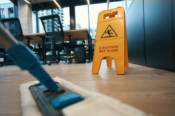 Cleaning with special mop in the modern office stock photo